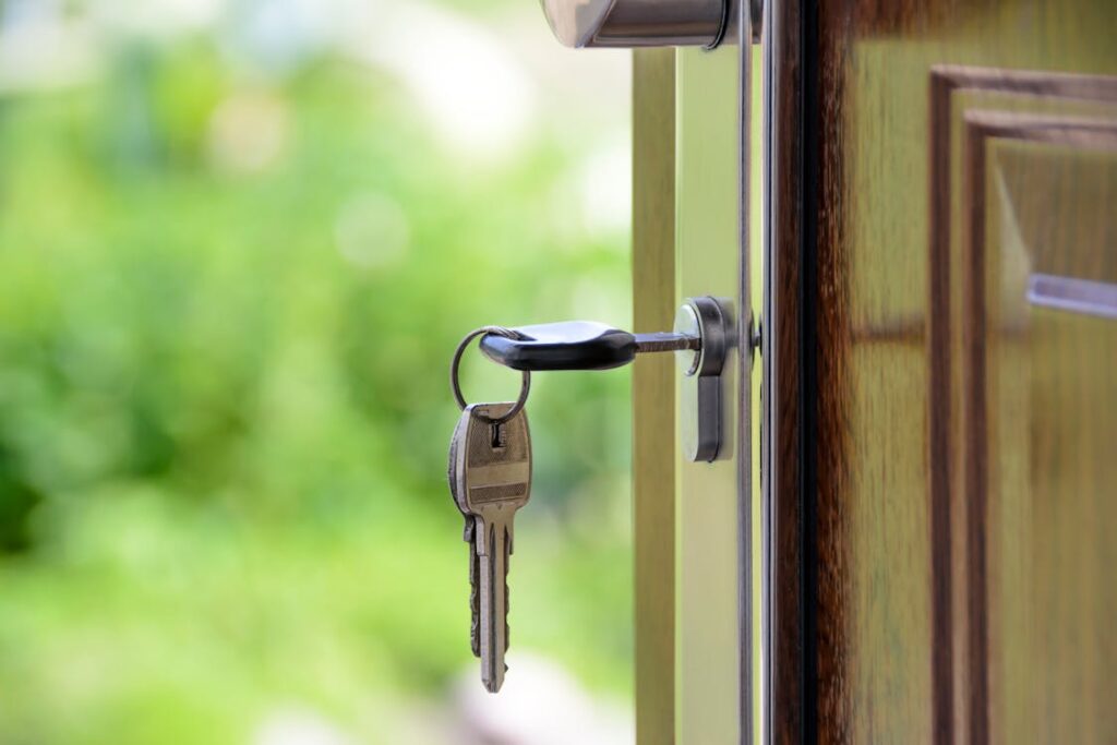 Realtor's Guide to Hyperlocal SEO: Data Reveals How to Dominate Neighborhood Searches in 2026 15 Clean, modern image of a magnifying glass focused on a specific street on a printed map of a residential neighborhood, sym...
