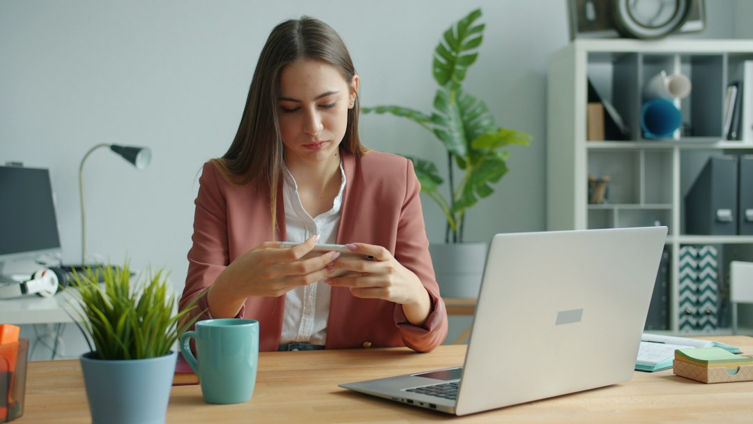 A real estate professional in a bright, modern office uses a tablet to strategically navigate the digital market, representing a clear advantage over the competition.